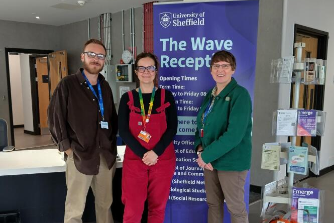 the mental health hub team pose in the reception of the University